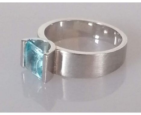 A single stone topaz ring, the square-cut topaz, semi-bezel set, stamped 18ct, size O, 8.33g and a pair of single stone topaz