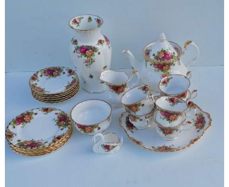 A Royal Albert Old Country Roses tea service comprising six cups/saucers/plates, teapot, jug, sugar bowl, biscuit plate, vase
