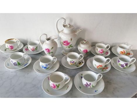 A Meissen hand painted 'Rose Moss' pattern coffee pot, jug and sugar bowl, three matching cups with swan neck handles and mat