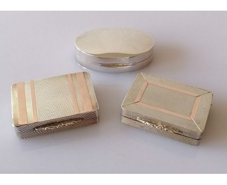 Three cased contemporary silver pill or snuff boxes with gilt interiors, two with engine turned decoration and gold inlay, th