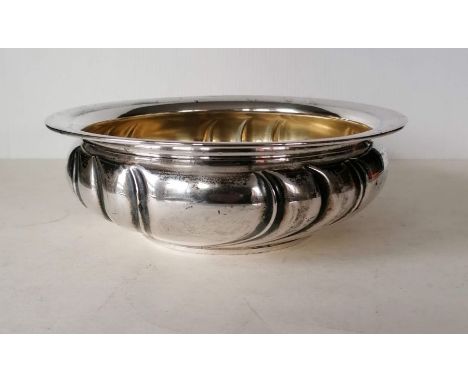 A circular 800 silver basin with gilt interior on a flat base, 8 cm H x 24 diameter, 479g