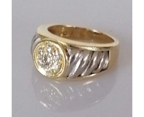 A diamond cluster ring with seven round brilliant-cut diamonds weighing an estimated total of 0.38 carats, set in white metal
