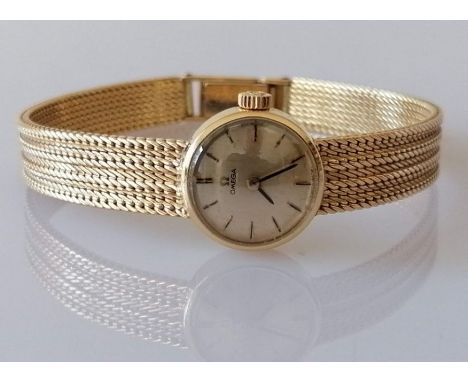 An Omega ladies manual-wind dress watch with gold dial, baton markers, signed to face, crown, case, clasp and mechanism, ref.