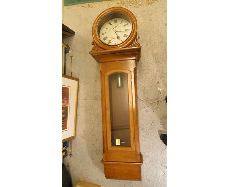 A Swindons and Sons large light oak drop dial wall clock having full length glazed trunk body and white enamel dial, 13 diame