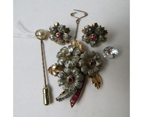 A 1940s French ruby and diamond brooch with matching earrings along with a pearl set stick pin and cubic zirconia stones