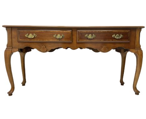 Georgian design walnut console table, rectangular crossbanded top, fitted with two drawers over shaped apron with shell mould