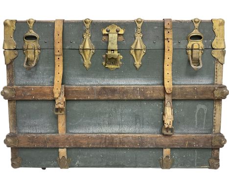 Early 20th century leather bound travelling trunk. teal leather exterior with oak strapping and gilt metal mounts, rectangula