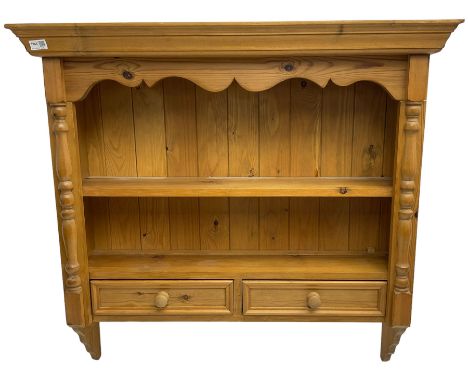 Pine farmhouse wall hanging shelf, shaped apron over single shelf and two drawers, flanked by split turned pilastersDimension