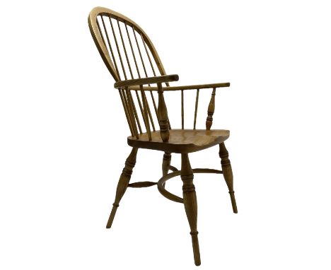 Light elm Windsor armchair, double hoop and stick back, on turned supports united by crinoline stretcher Dimensions: Height:&