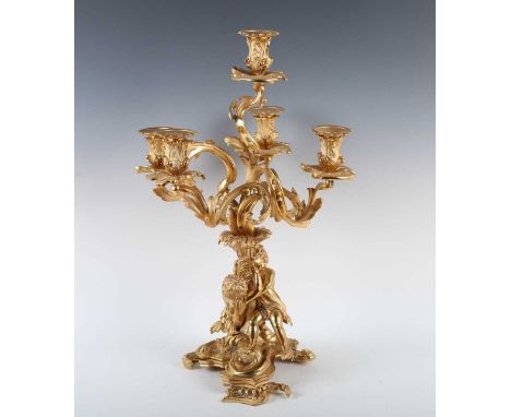 An impressive late 19th century French Rococo Revival cast ormolu five-light candelabrum with figural stem and scroll base, h