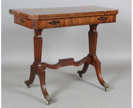A Regency mahogany and hardwood inlaid fold-over card table, raised on tapering supports and splayed legs, height 75cm, width