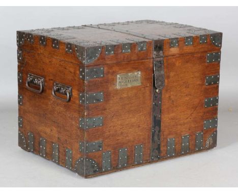 An early 20th century oak and iron bound silver trunk by Goldsmiths &amp; Silversmiths Ltd, the front with applied brass plaq