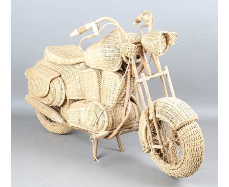 A late 20th century woven rattan full-scale model of a motorcycle, height 105cm, length 178cm.