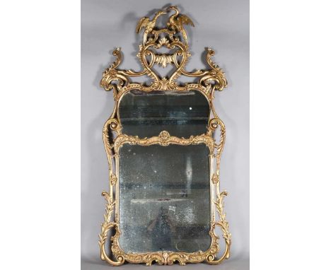 An impressive 19th century Rococo Revival giltwood wall mirror, in the manner of Thomas Chippendale, the ornate scrolling fra