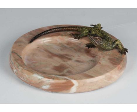 An early 20th century Austrian cold painted bronze model of a lizard, length 15cm, mounted on a circular hardstone dished bas