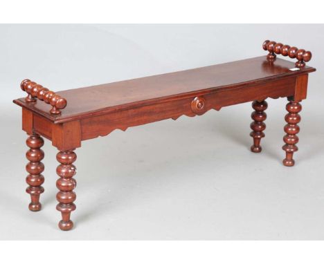 A Victorian mahogany window seat with bobbin turned handles and legs, height 47cm, width 120cm, depth 27cm.