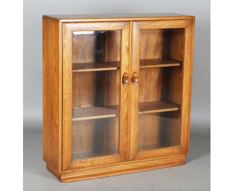 An Ercol elm glazed two-door bookcase, height 97cm, width 92cm, depth 29cm.