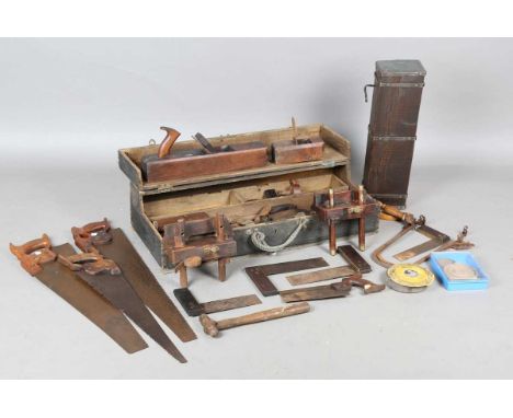 A collection of 19th and early 20th century carpentry tools, including two sash planes, other planes, saws, gauges, set squar