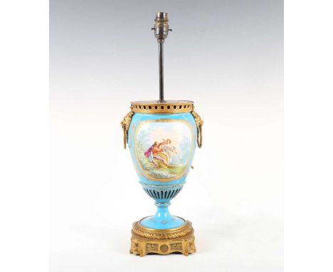 A late 19th century Sèvres style porcelain and ormolu mounted table lamp, the ovoid body painted with a couple opposing a flo