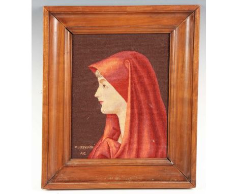 A 20th century Aubusson tapestry panel depicting a profile portrait of a lady, 36cm x 27.5cm, within a walnut frame.