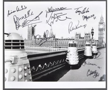 Doctor Who - An impressive multi-signed autographed 12x14" black and white photograph from the series, signed by x11 stars wh