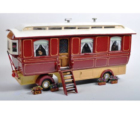 A charming hand made 1/16 scale (believed) Circus / Fun Fair related showman's live-in Caravan vehicle. The caravan superbly 