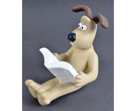An original Aardman Animations Gromit prototype display item / figurine. The Gromit of resin construction moulded to a seated