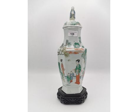 A Chinese famille vert porcelain lidded vase, 18th century, the hexagonal body applied with polychrome enamels depicting wome