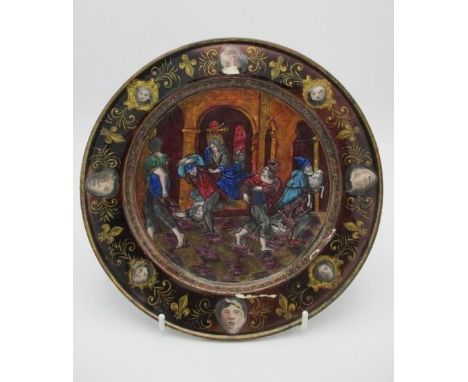 An 18th/19th century Limoges enamel plate in the style of Pierre Reymond decorated to the centre with an interior scene of pe