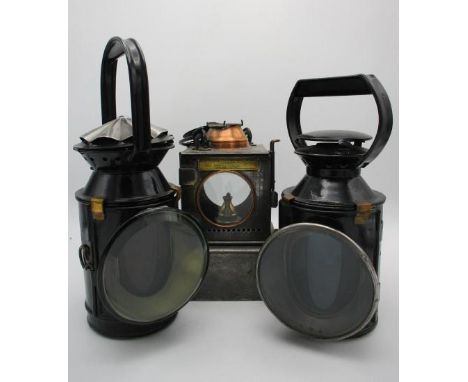 Two black painted railway lamps with rotating handles, blue and red lenses, 11" h and 13"h and an early 20th century BR(E) We