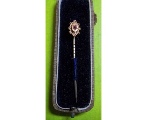 9CT GOLD AND RUBY SET STICK PIN IN A FLINN & CO CASE