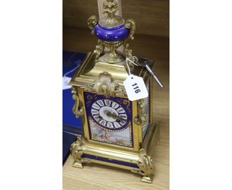 A 19th century French gilt brass and porcelain mounted mantel clock