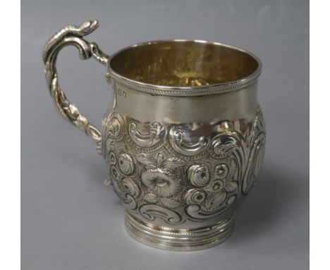 A George IV embossed silver christening mug, London, 1821.