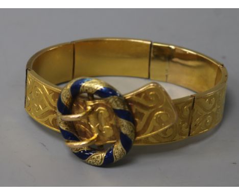 A Victorian engraved gold and blue enamel "buckle" bracelet (a.f),
