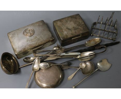 Minor silver cutlery including a William IV caddy spoon, a silver toast rack, two cigarette boxes and a tobacco box.