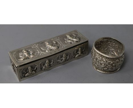 An Indian embossed white metal rectangular snuff? box and a white metal napkin ring.