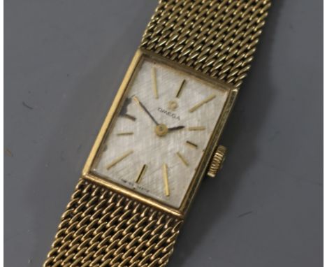 A lady's 9ct gold Omega manual wind wrist watch.