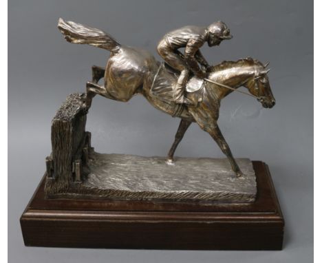 After R. Donaldson- A modern silver overlaid model of a racehorse and jockey jumping a fence, Camelot Silverware Ltd, London,