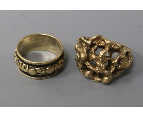 A George IV gold and black enamel mourning ring and a 9ct textured gold ring.