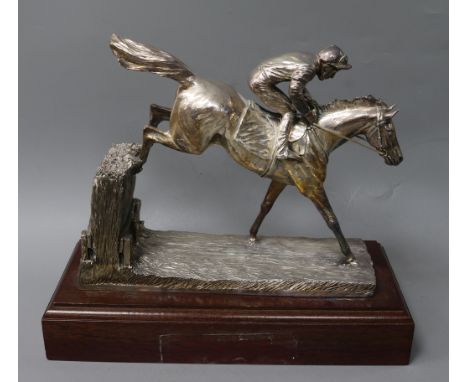 After R. Donaldson- A modern silver overlaid model of a racehorse and jockey jumping a fence, Camelot Silverware Ltd, Sheffie