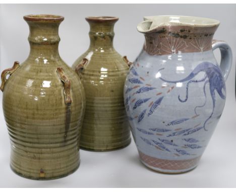 A Chris Patton Studio pottery earthenware jug and a pair of Michael Leach Yelland Pottery three-handled vessels the Patton ju