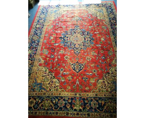 A Turkish carpet (worn) 330cm x 245cm