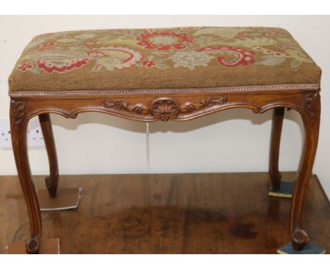 A Louis XV style carved beech stool with tapestry-upholstered seat W.66cm