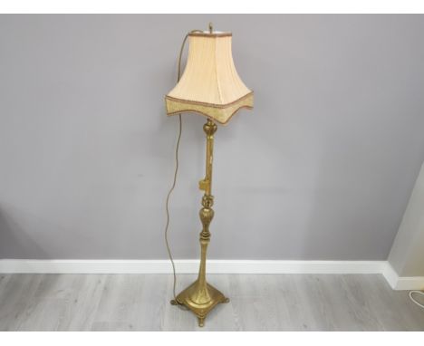 Ornate brass standard lamp and shade