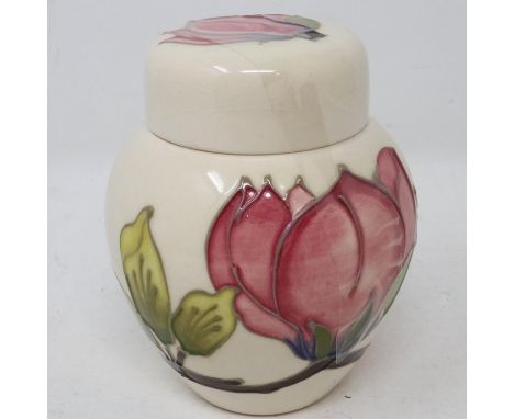 Moorcroft covered jar in the Pink Magnolia pattern, light crazing throughout but no cracks or chips, H: 13 cm. UK P&amp;P Gro