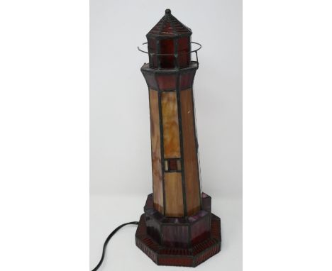 Coloured glass Lighthouse lamp with damages. All electrical items in this lot have been PAT tested for safety and have passed