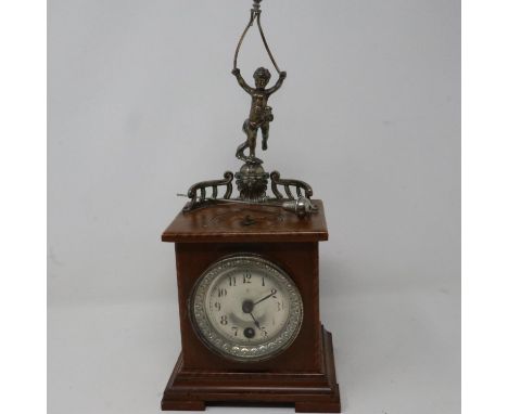 Junghans walnut cased table clock with spinning pendulum movement, not working at lotting, signs of woodworm to case, H: 33 c