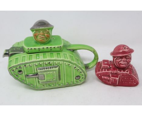 Sadler early 20th century tank or landship form teapot (repair to handle), with a similar style money bank, largest L: 22 cm.