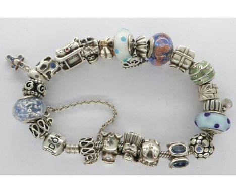 925 silver Pandora charm bracelet with twenty charms, boxed, L: 20 cm. UK P&amp;P Group 1 (£16+VAT for the first lot and £2+V