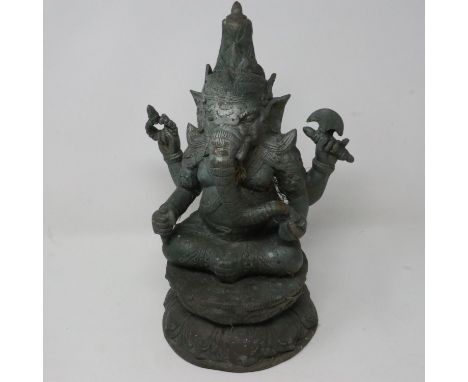 Late 19th century hollow cast metal figure of Ganesh raised on a lotus form plinth, H: 30 cm. UK P&amp;P Group 3 (£30+VAT for